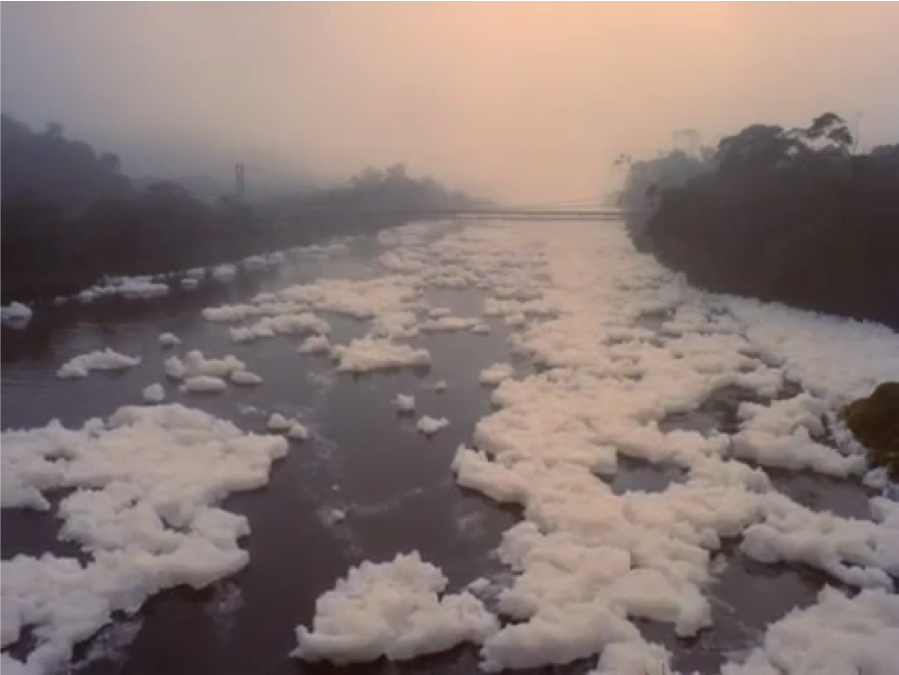 Another film still of the foam floating on the water.