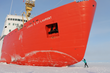 large red ice-breaker ship with figure in the corner